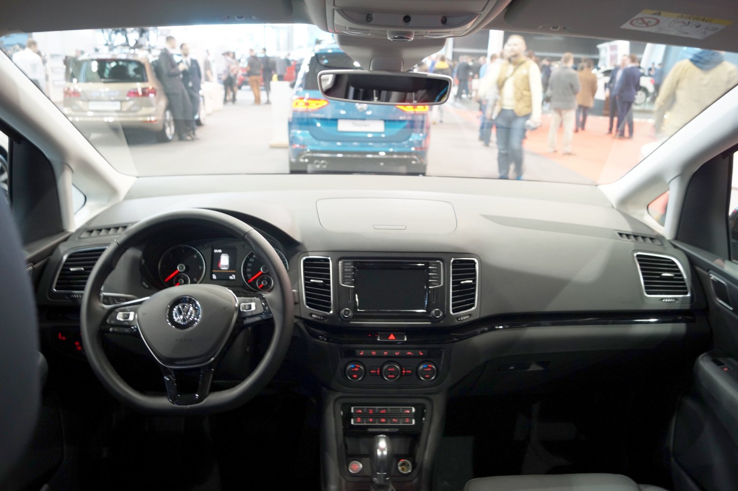 Interior dashboard and steering wheel with infotainment and climate controls