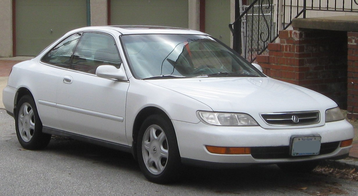 White coupe with sleek front side profile and smooth curved body