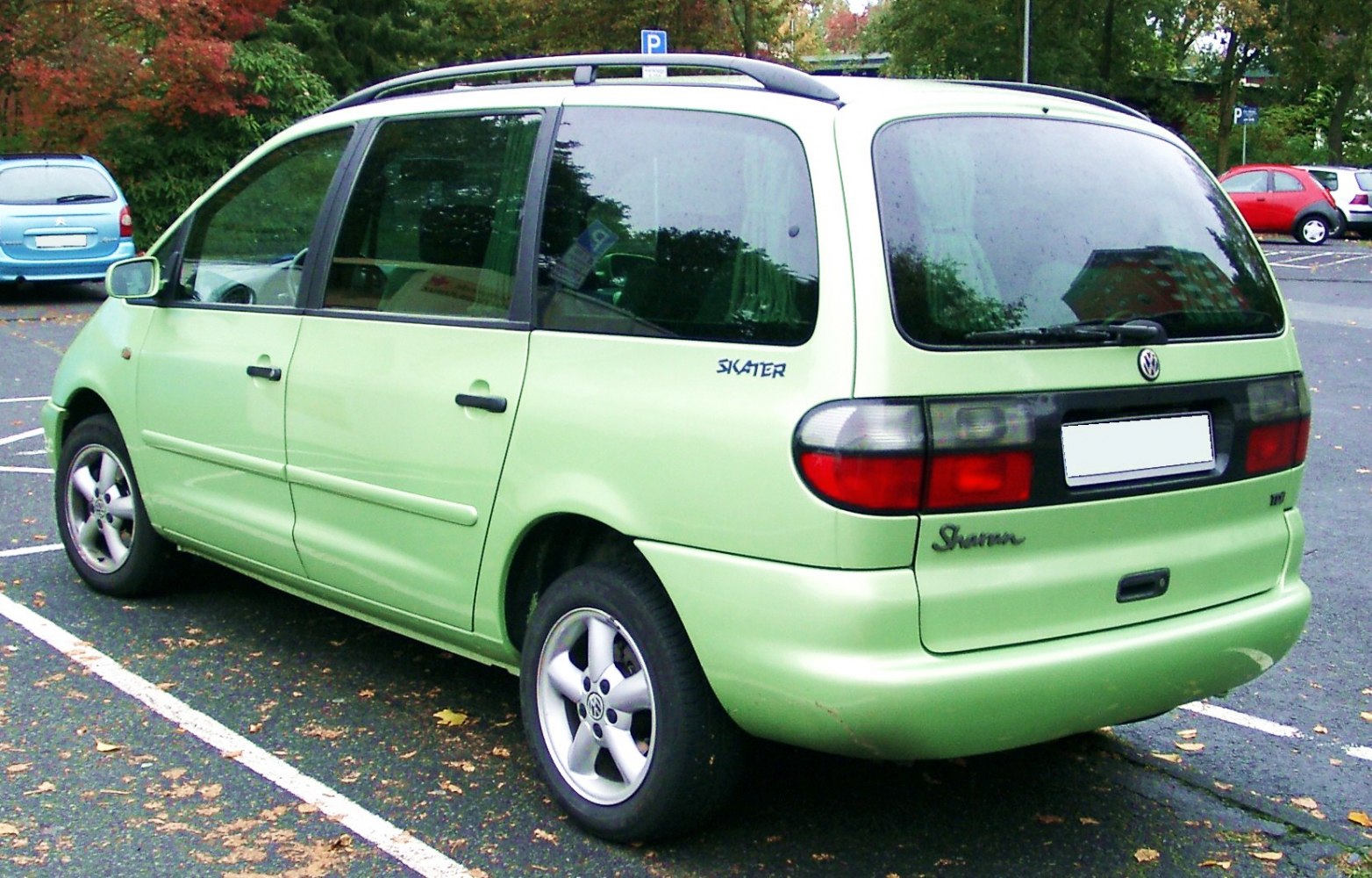 Rear and side view of a minivan with distinctive taillights and large windows