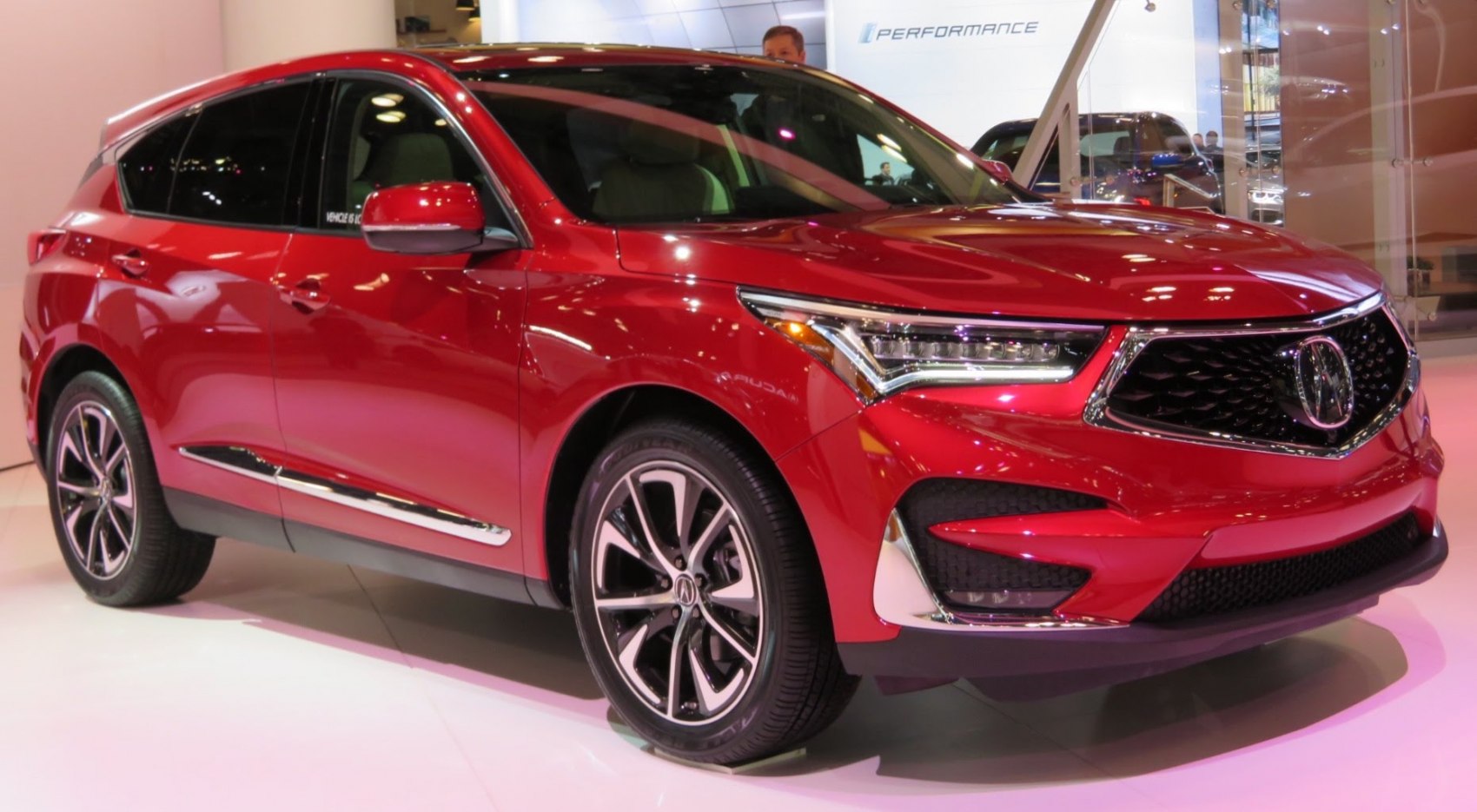 Red luxury SUV with LED headlights and alloy wheels