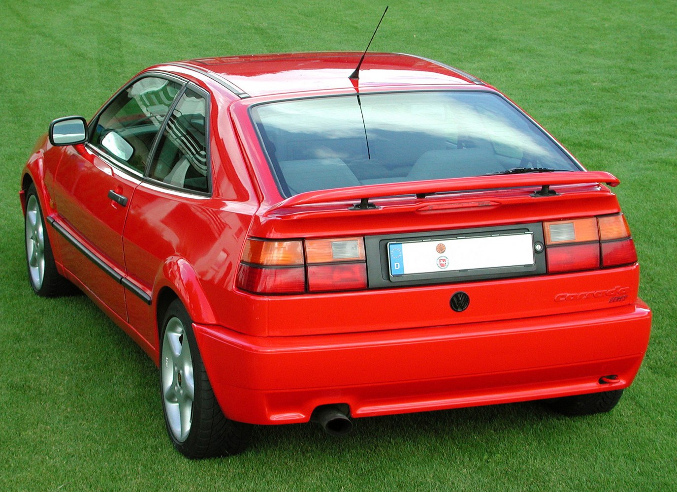 Rear view of sporty hatchback with rear spoiler and distinctive taillights