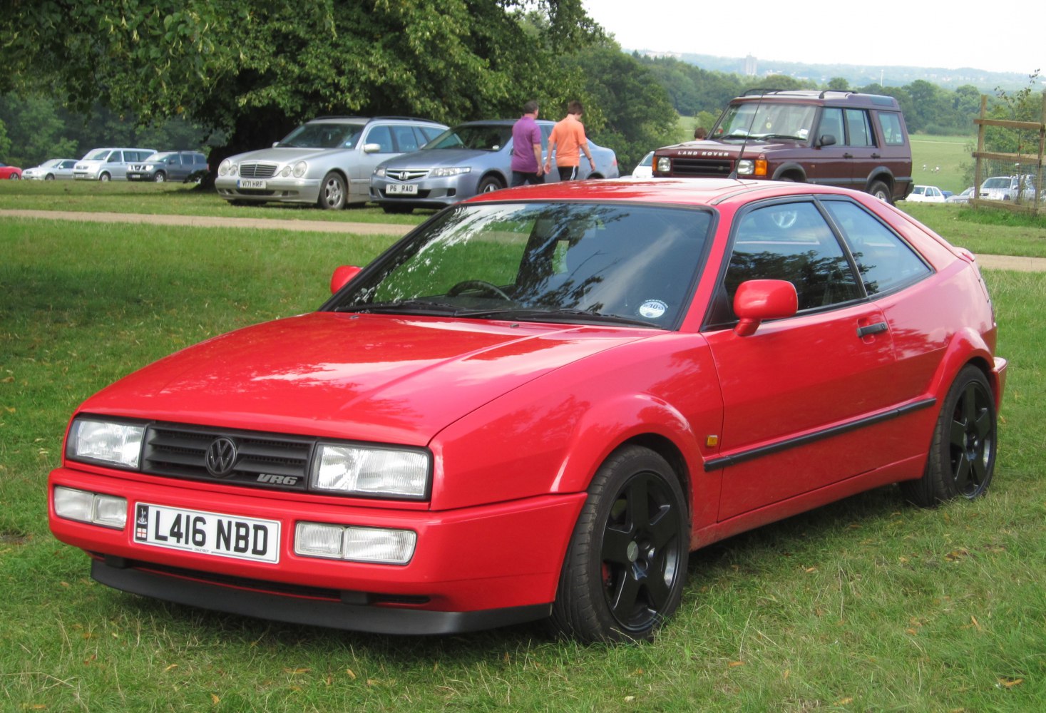 Red VR6 coupe with black wheels and 1991 facelift design