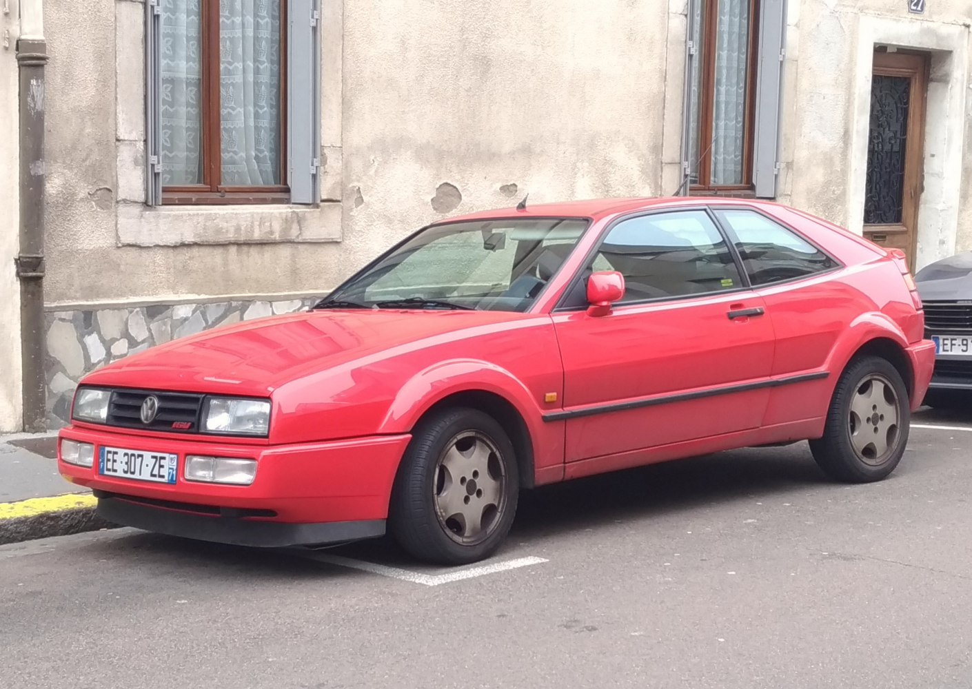 Red sporty coupe with sharp front and side profile