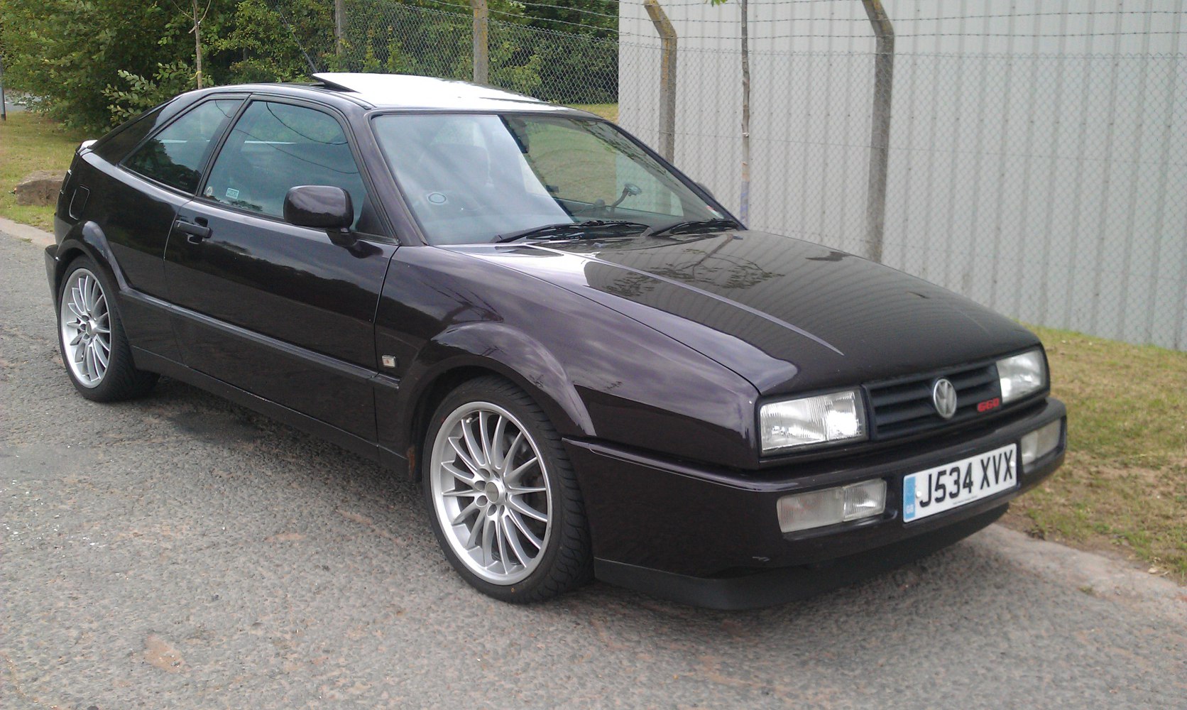 Sporty hatchback front three-quarter view with alloy wheels