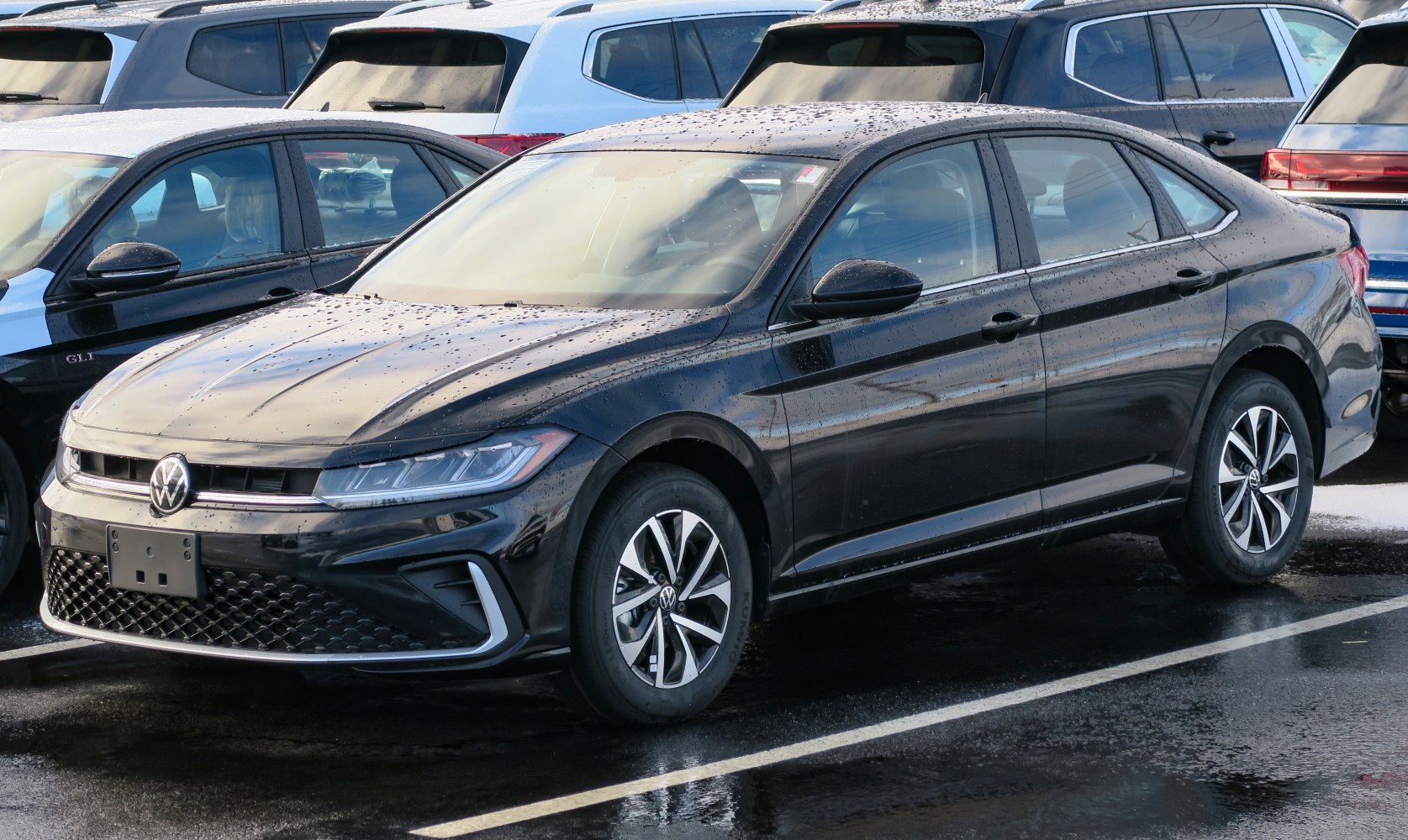Updated front grille and headlight design on a black sedan