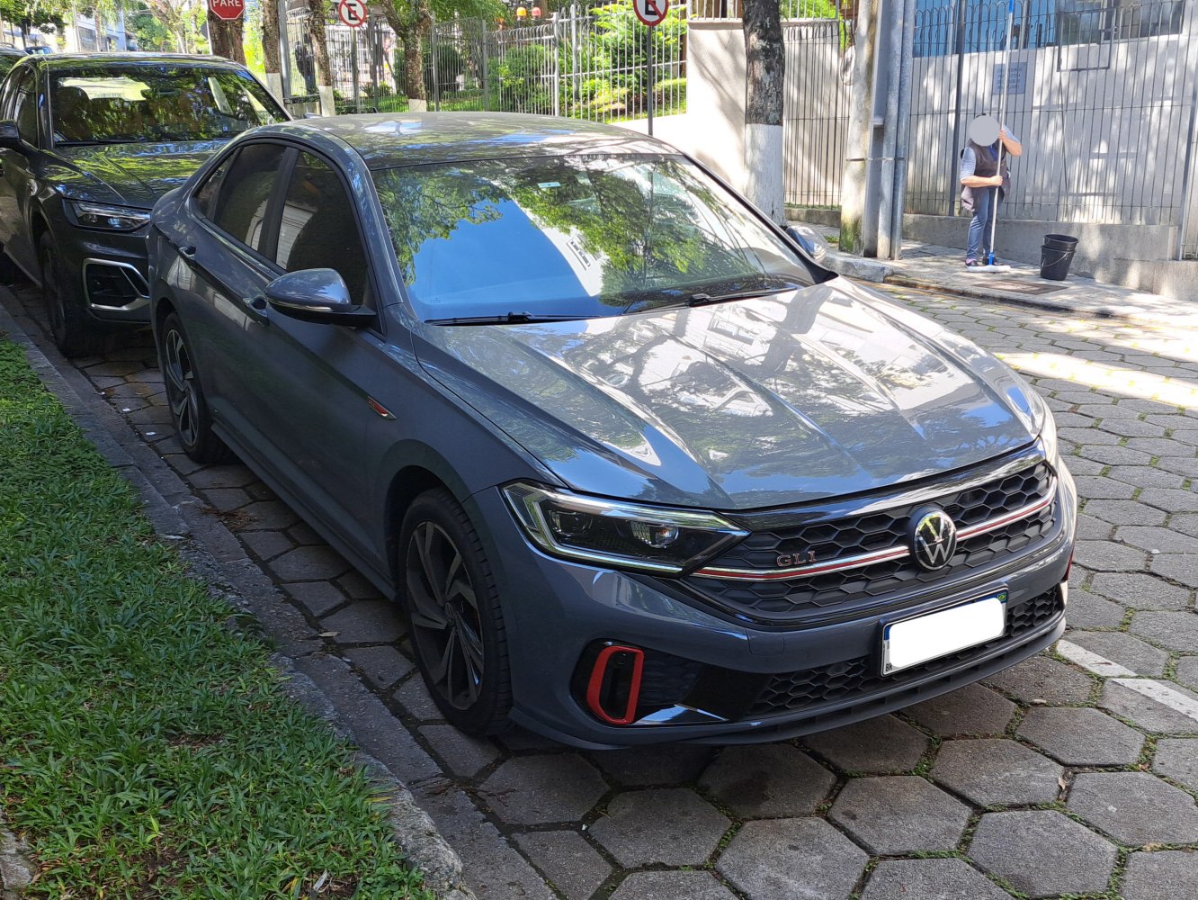 Front view of Volkswagen Jetta VII GLI with hexagonal grille and sporty red accents