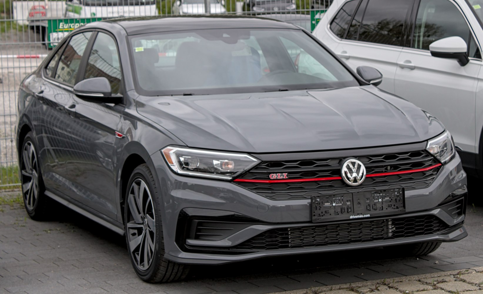 Front grille and headlights of a modern sporty sedan