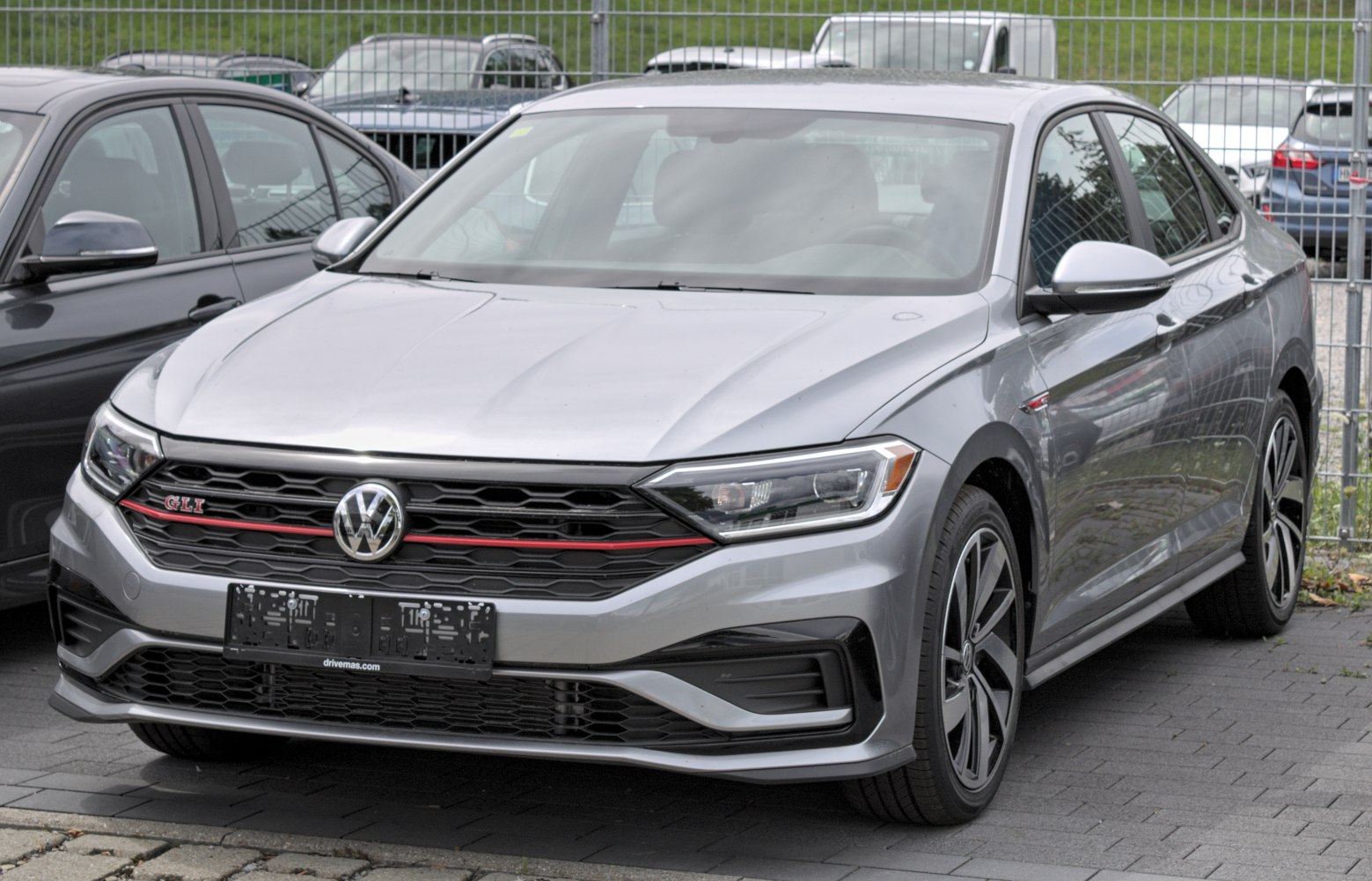 Front and side view with sporty grille and alloy wheels