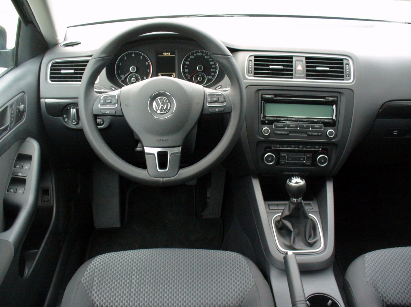 Manual transmission gear stick and multifunction steering wheel