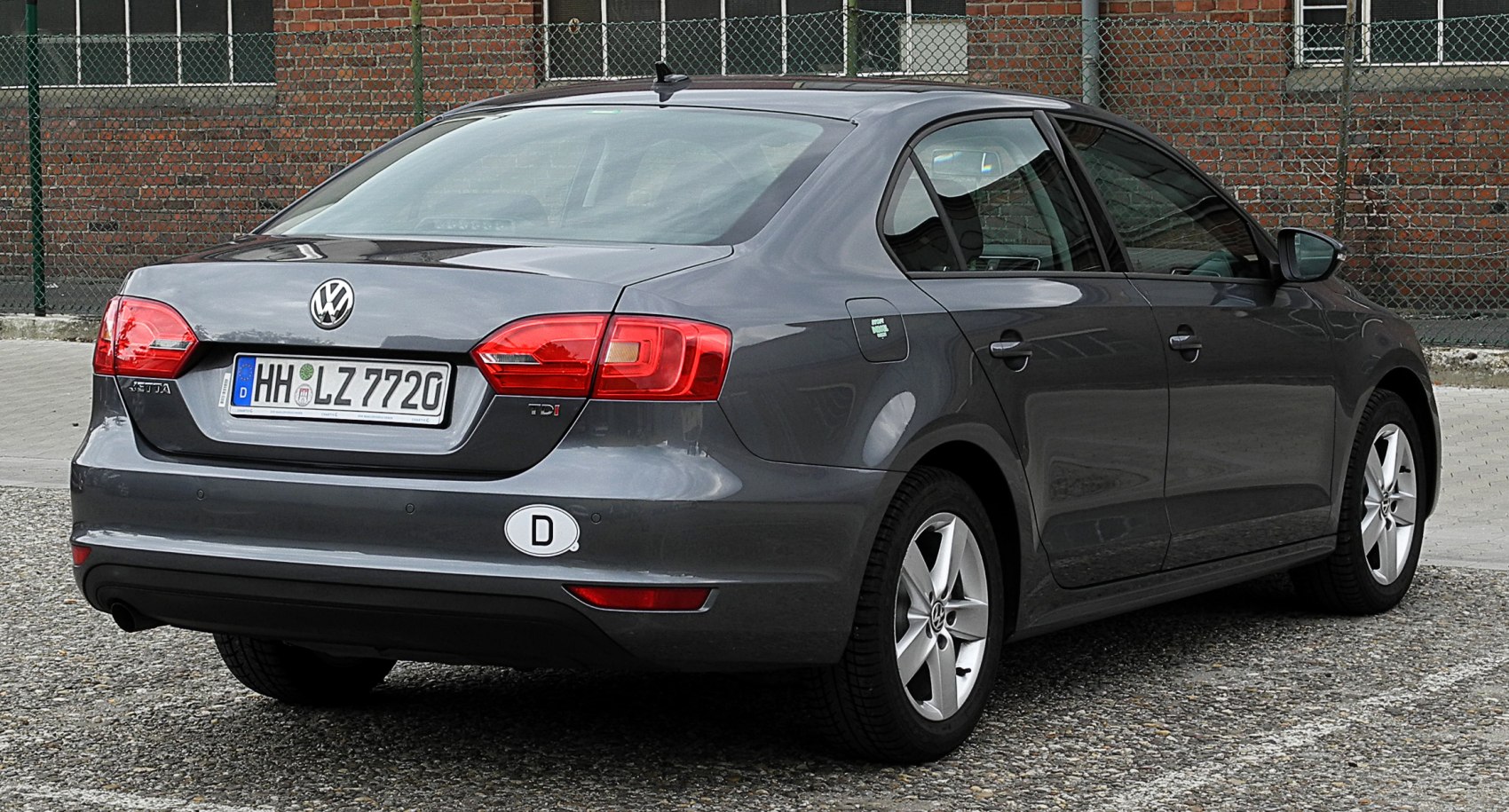 Rear view of sedan with TDI badge and alloy wheels