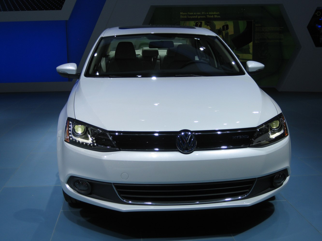 Front view of car with LED headlights and prominent grille