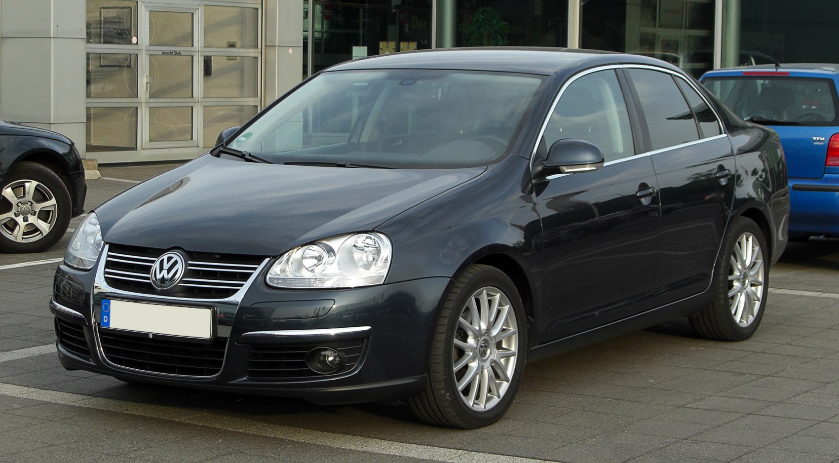 Front right side with headlights and alloy wheels