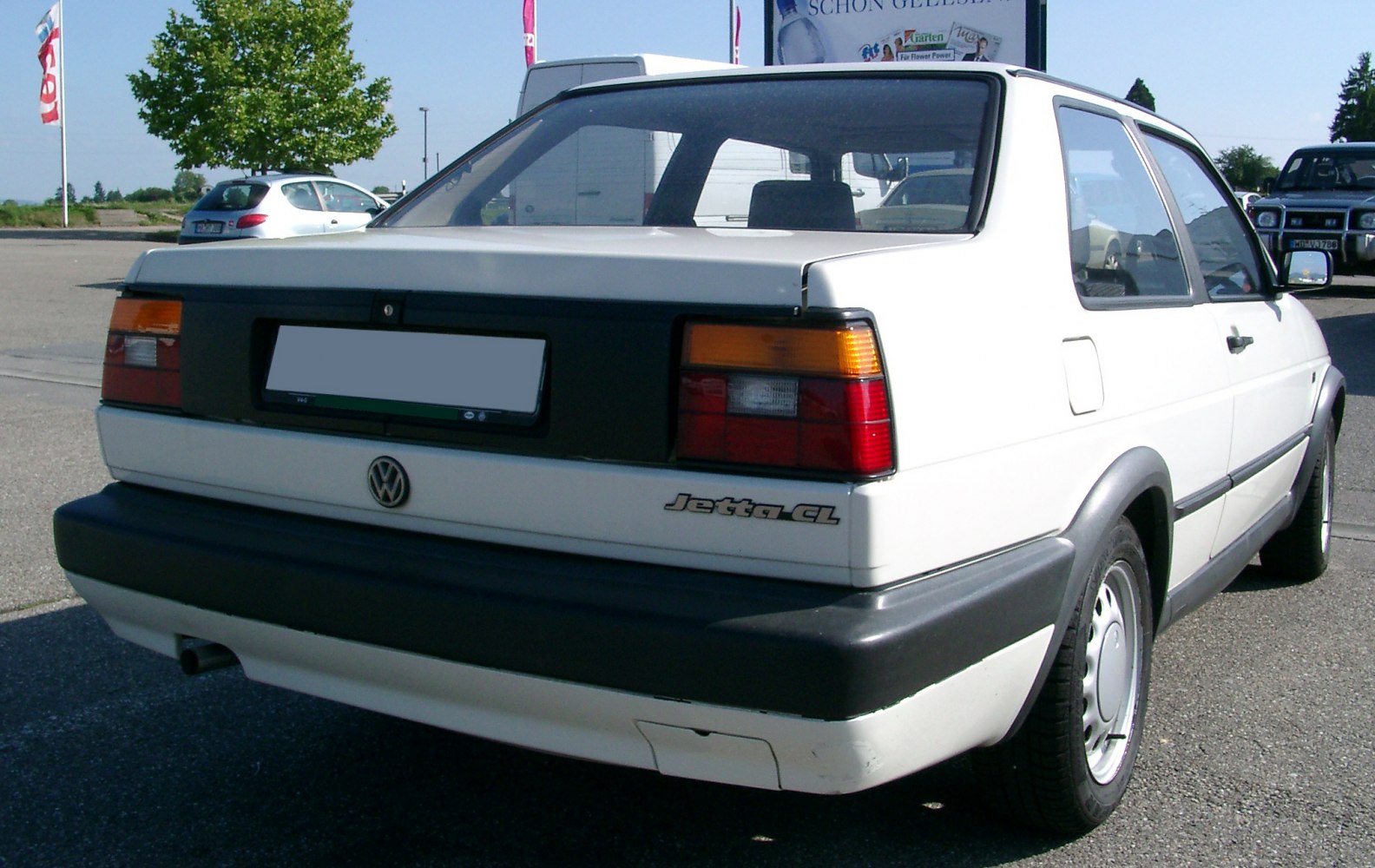 Rear view of a 1988 2-doors facelift sedan with black bumper