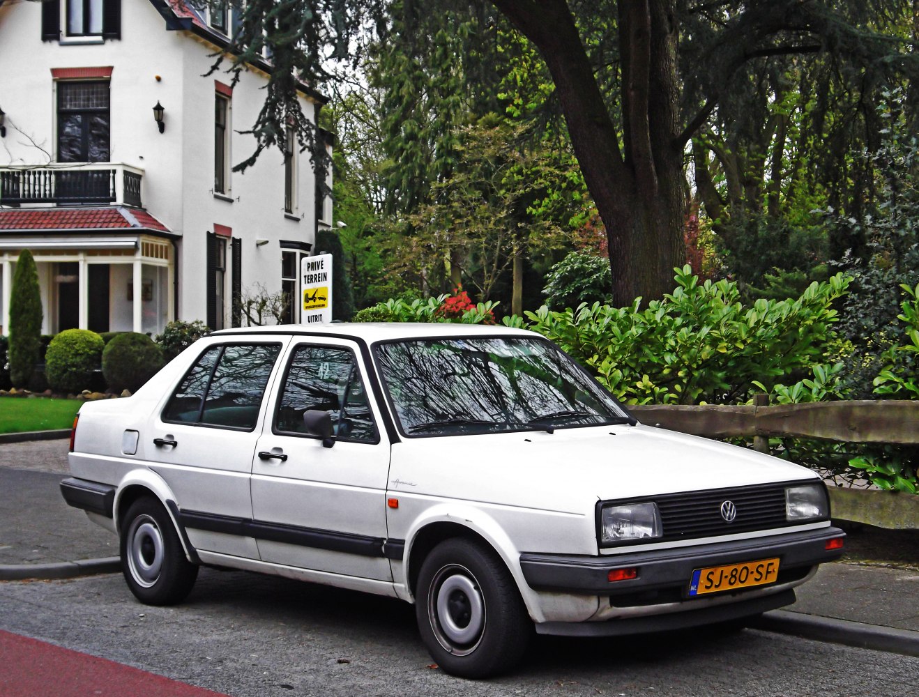 Classic four-door sedan with rectangular headlights and black trim