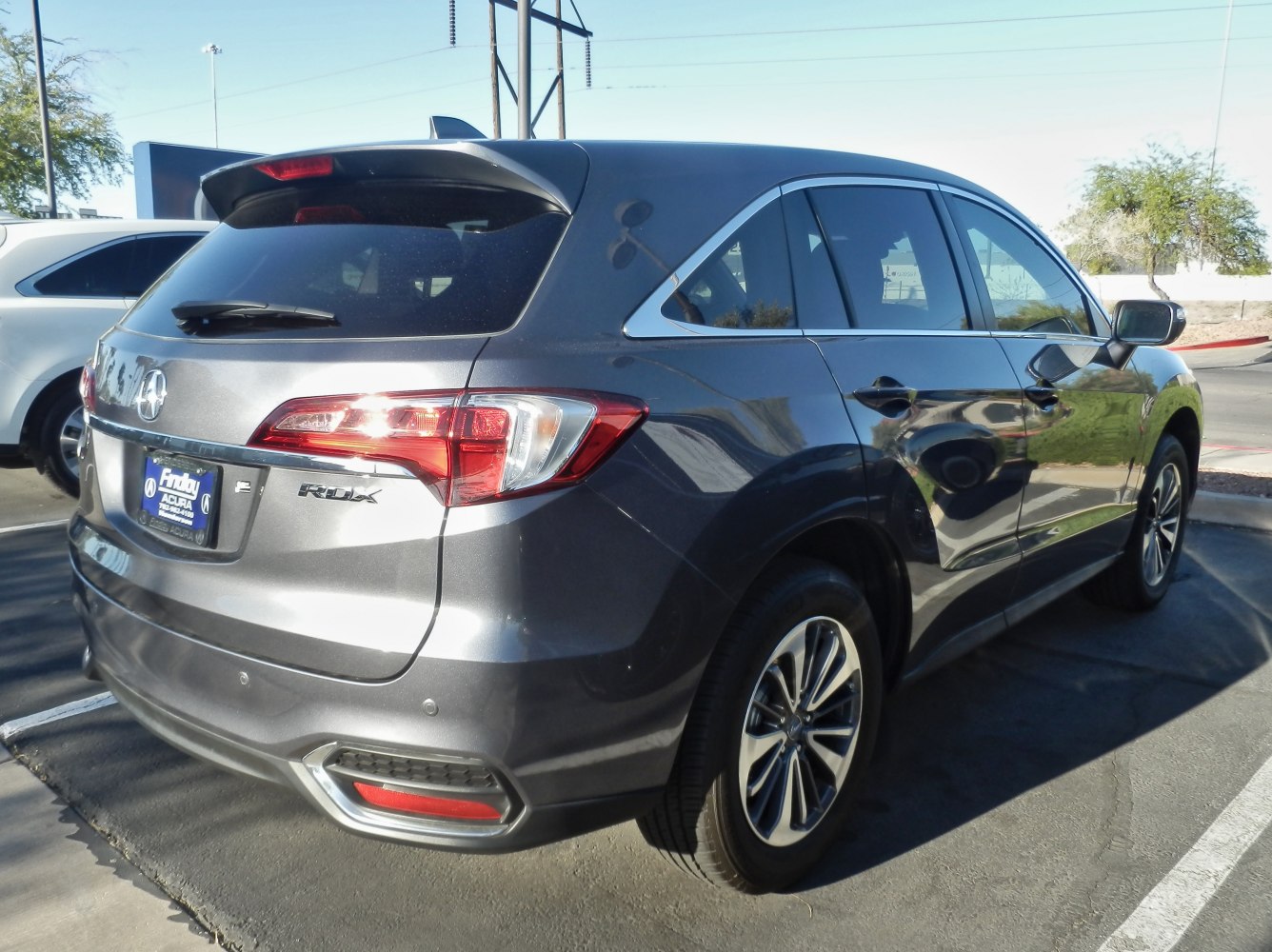 Rear-side view with taillights, spoiler, and alloy wheels of a facelifted compact SUV
