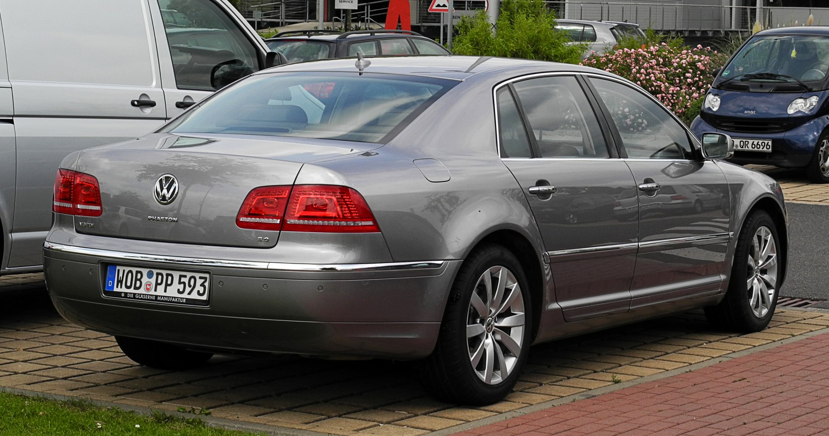 Rear and side view of a luxury sedan with distinct taillights and chrome trim