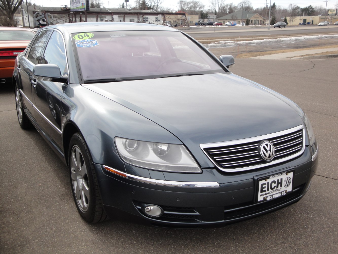Front grille and headlight cluster of a luxury sedan