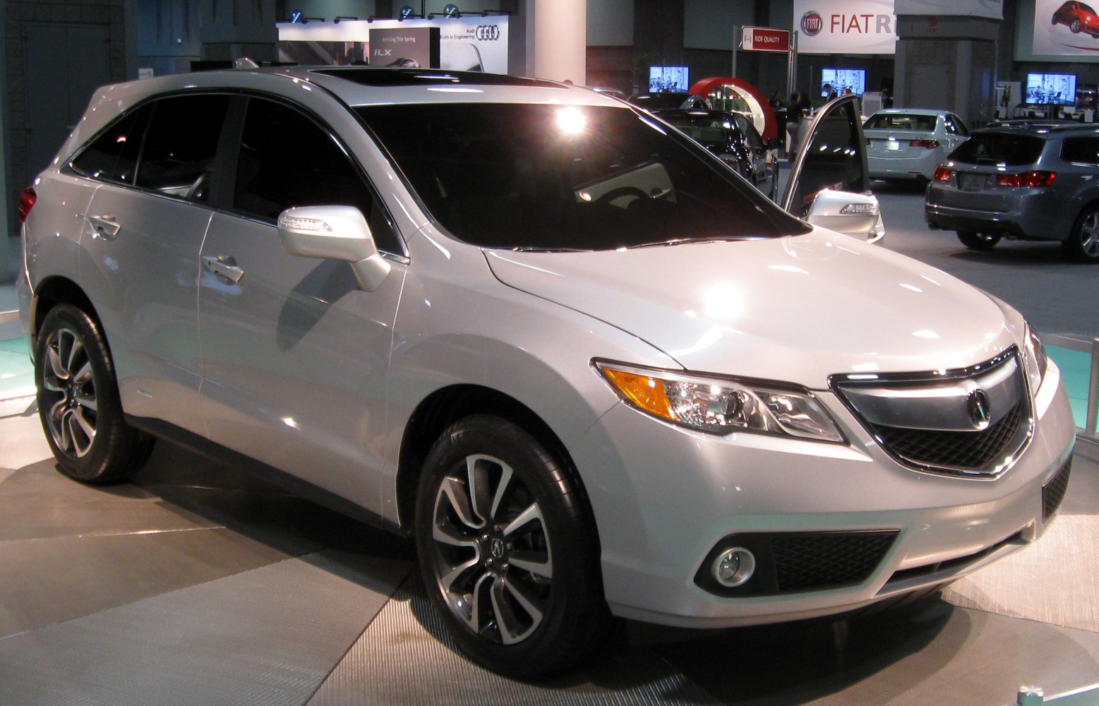 Front side of a silver SUV with alloy wheels and LED headlights
