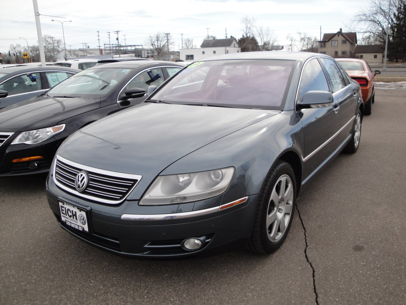 Front view of a luxury sedan with chrome grille and sleek headlights