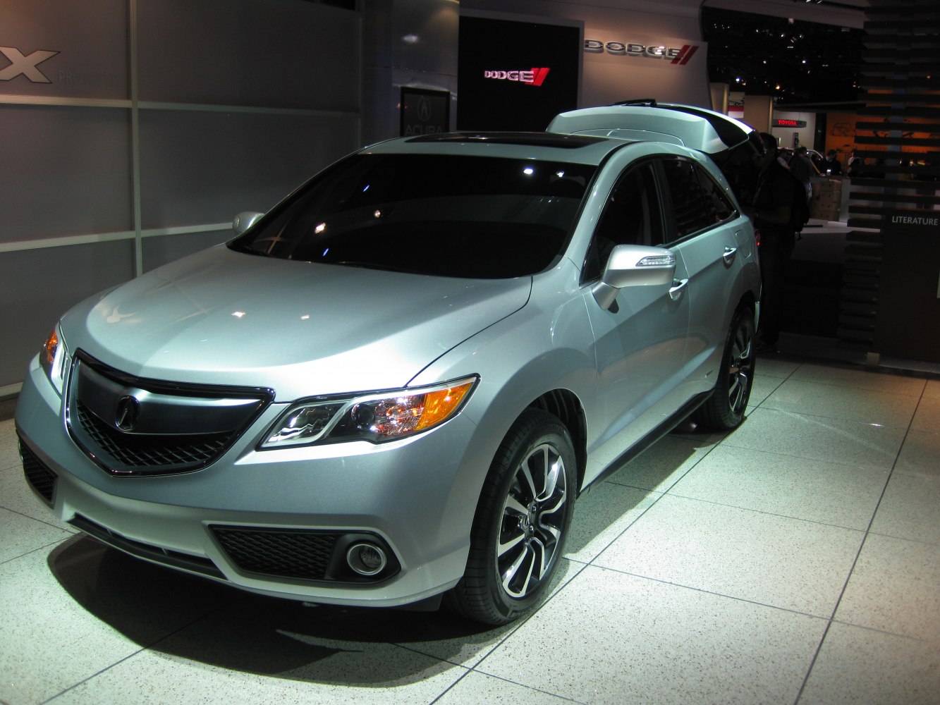 Front view of silver SUV with alloy wheels and sleek headlights