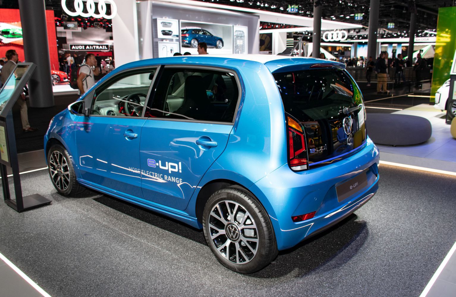Rear-side view of a compact electric hatchback with LED taillights
