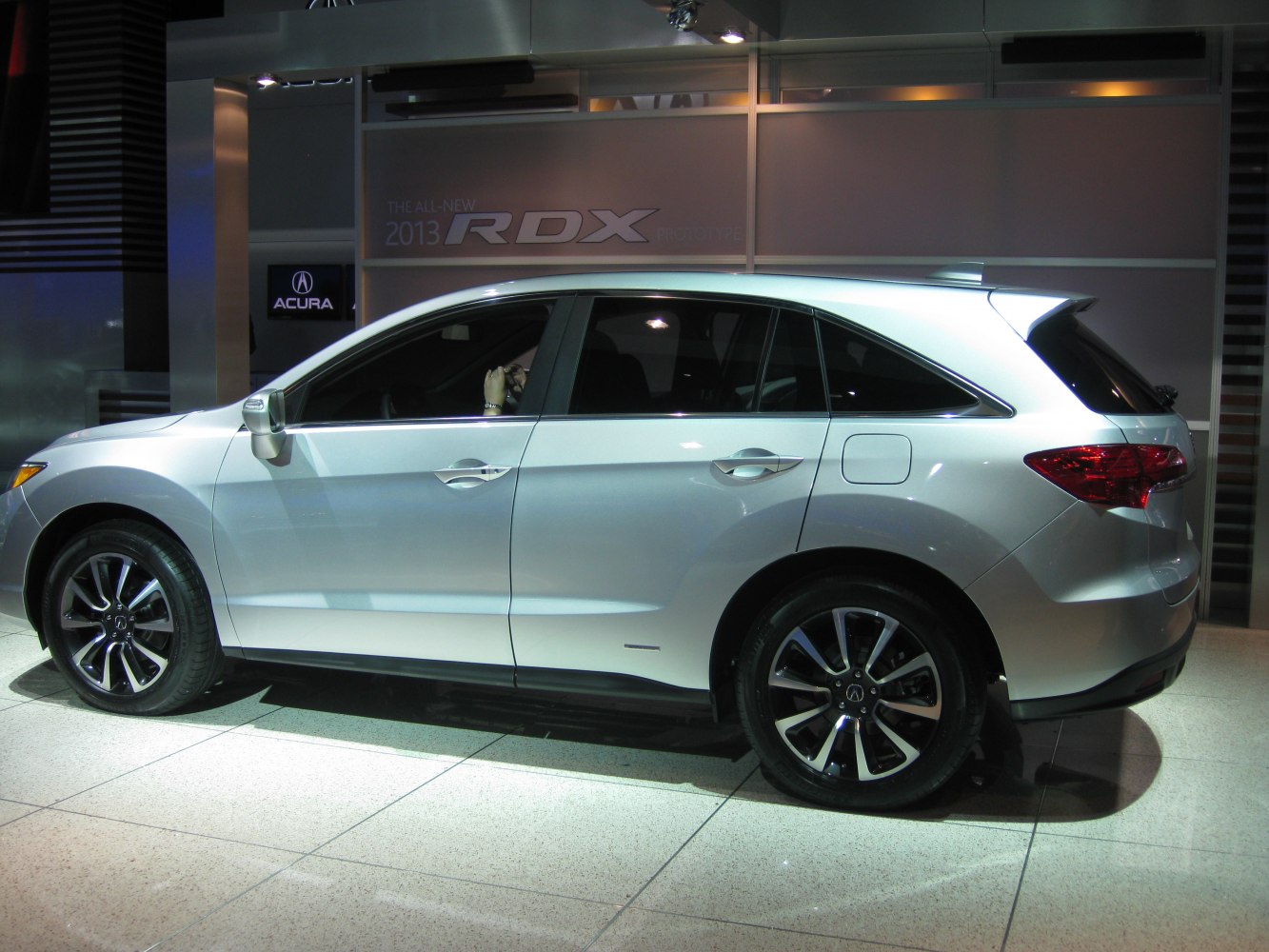 Sleek SUV side profile with alloy wheels and tinted windows