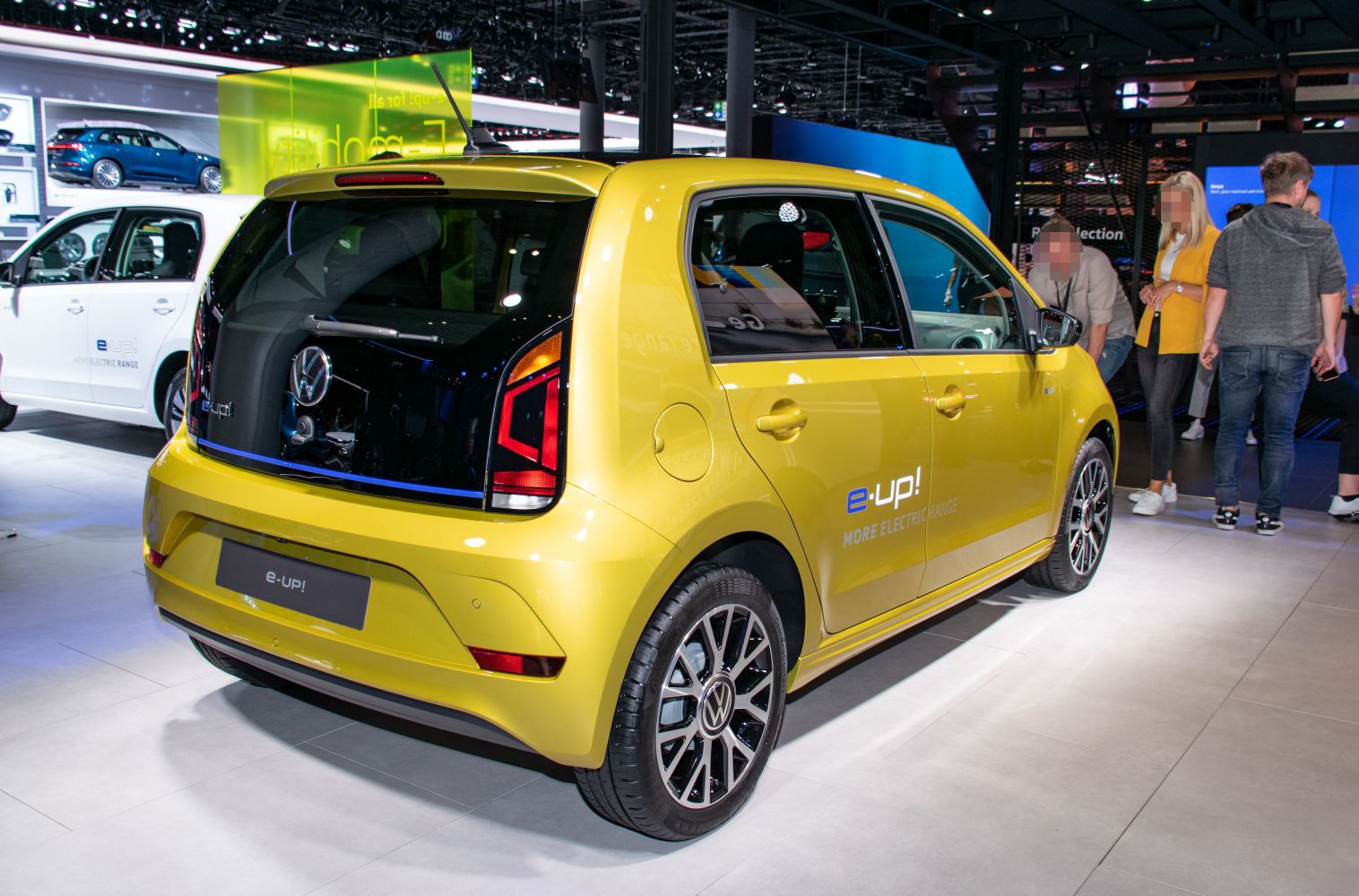 Yellow compact hatchback with black rear glass and LED taillights