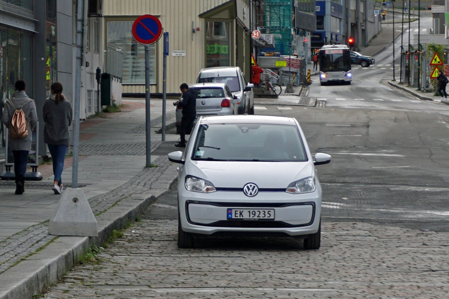Front view of a compact electric city car with distinctive headlights and grille