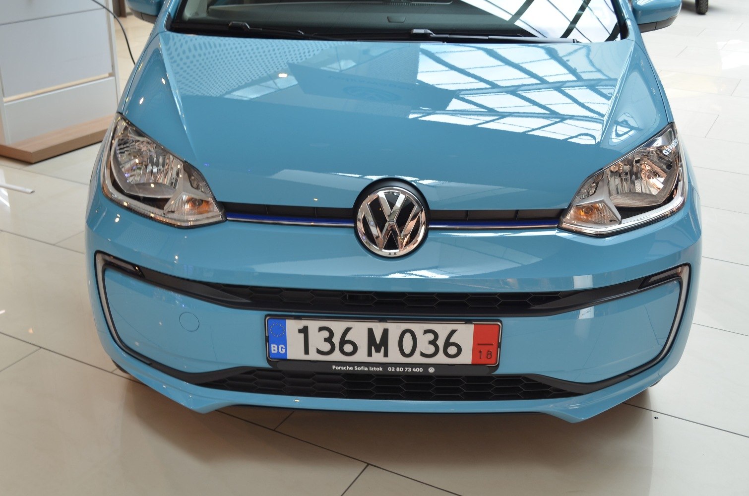 Front end with headlights and grille in blue paint