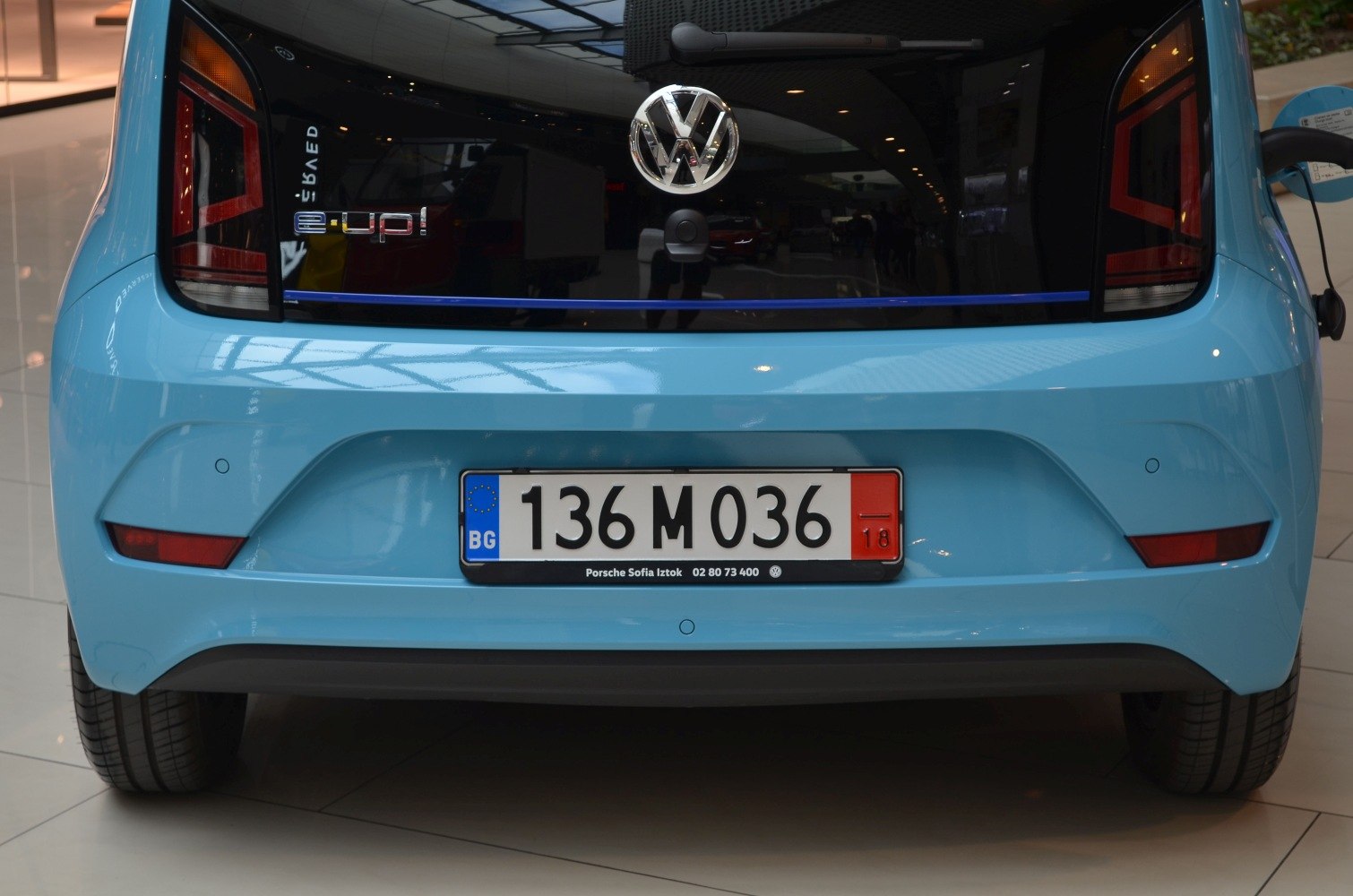 Rear view of a 2016 facelift electric hatchback showing tinted tail lights and license plate.