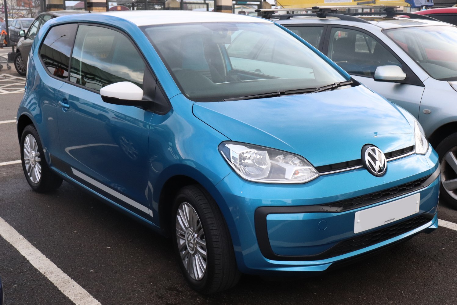 Compact blue hatchback with modern headlights and aerodynamic profile