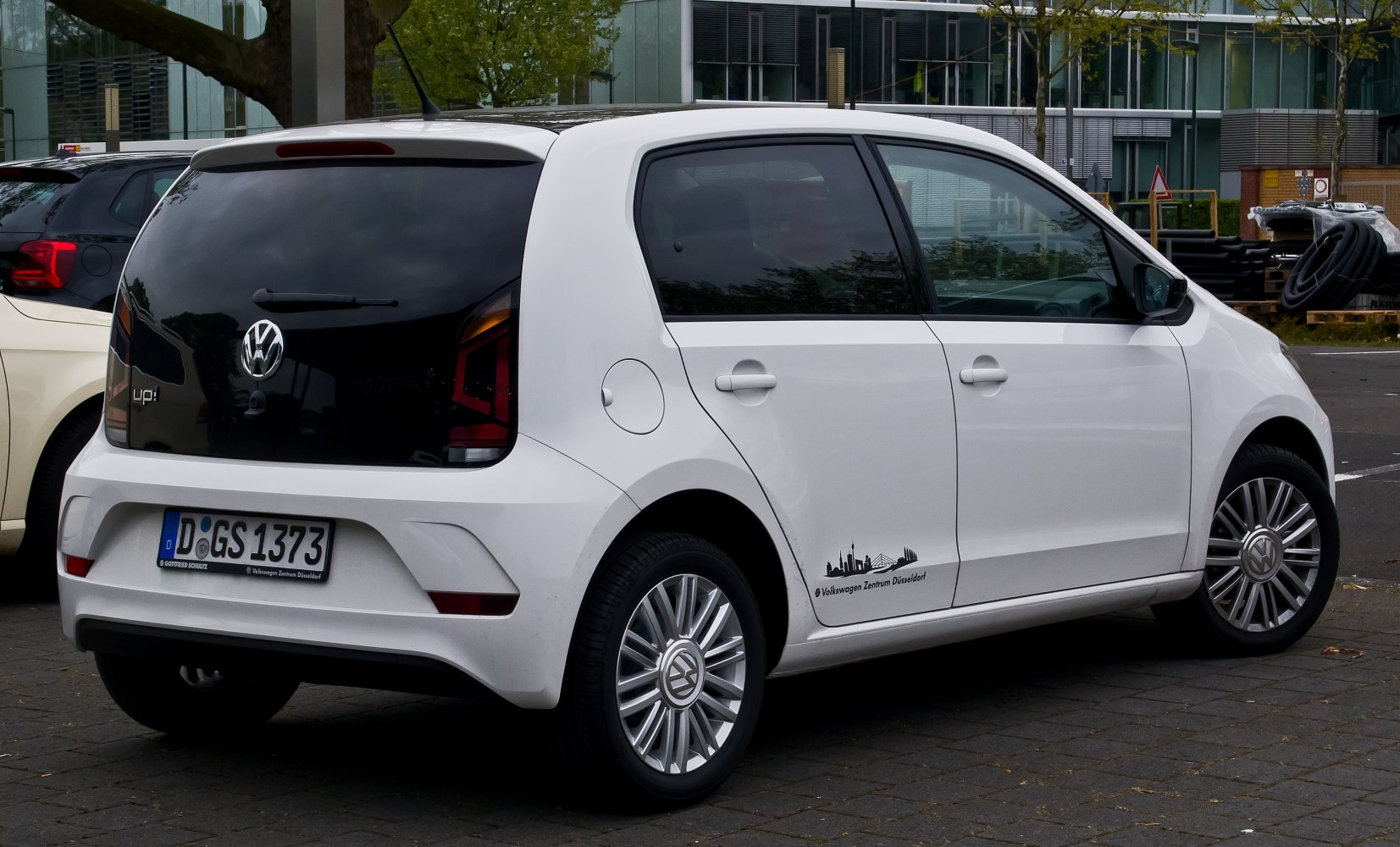 Rear and side view with black tailgate and unique taillights