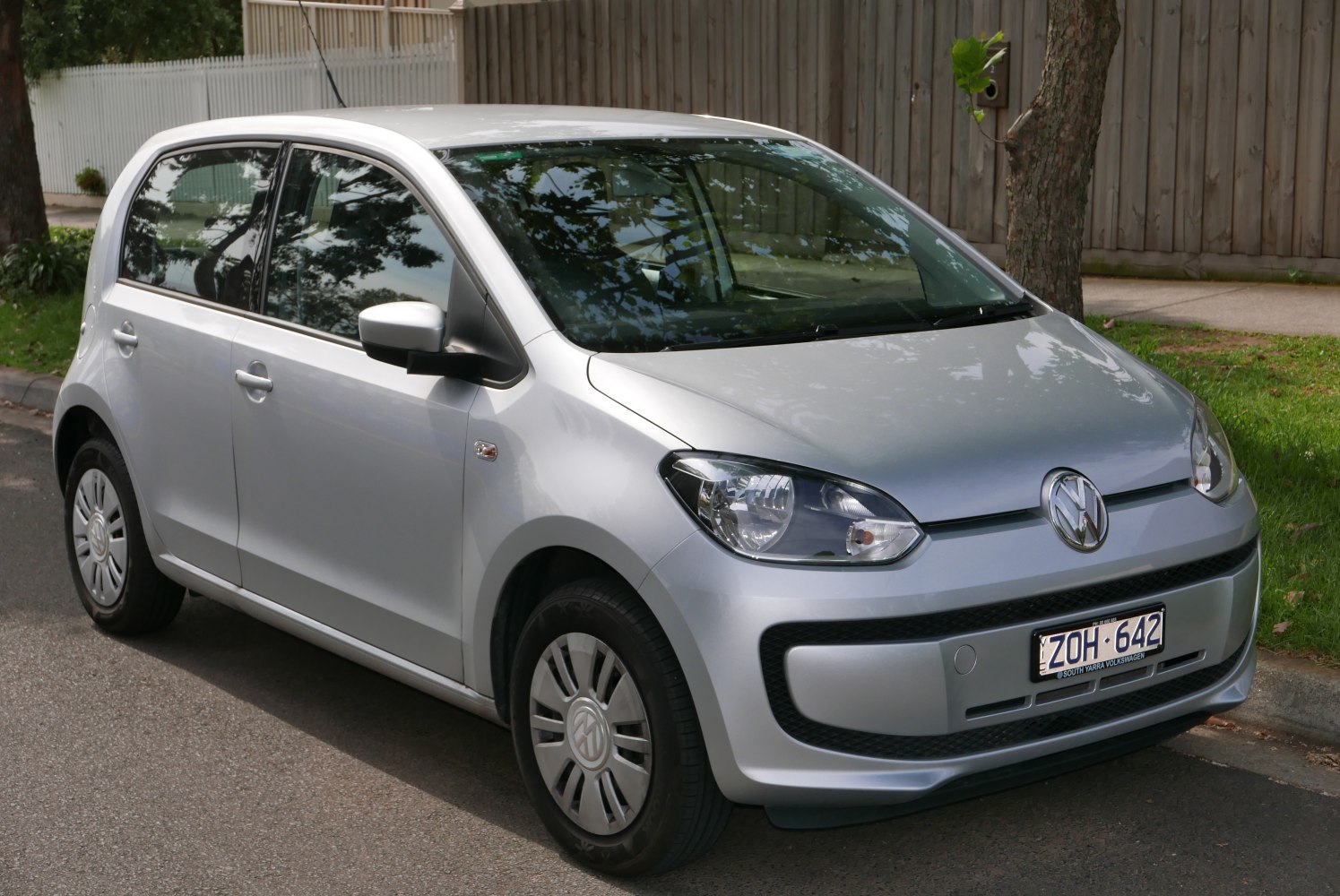 Compact hatchback front-side view with distinct headlights and a simple bumper.