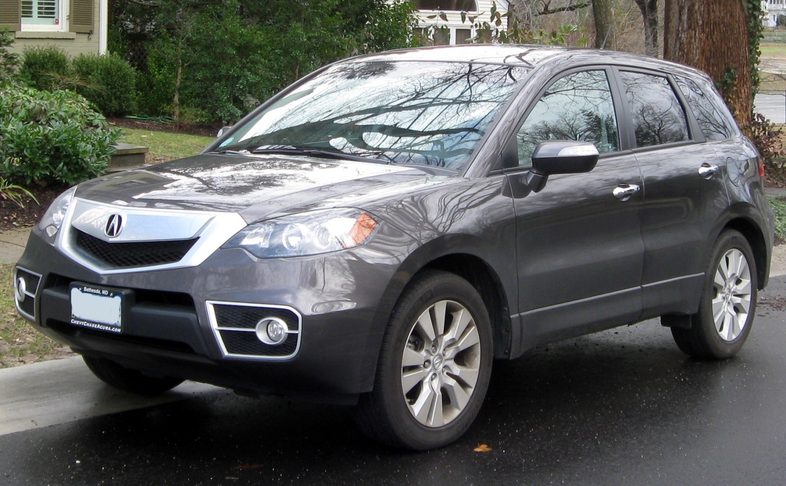 Front 3/4 view showcasing grille and alloy wheels