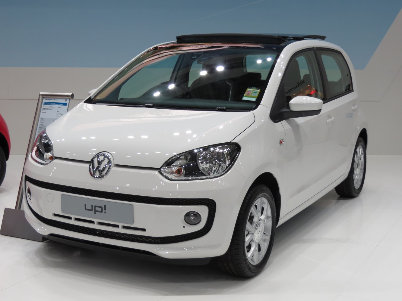 Front and side view of compact hatchback with panoramic roof