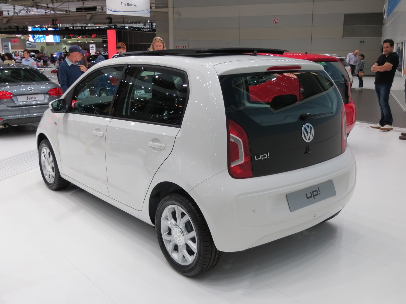 Rear and side view of a compact white five-door hatchback.