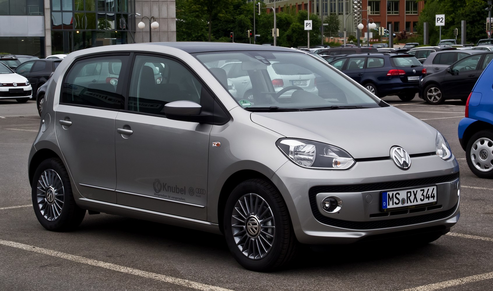 Silver compact 5-door hatchback with sharp headlights and alloy wheels