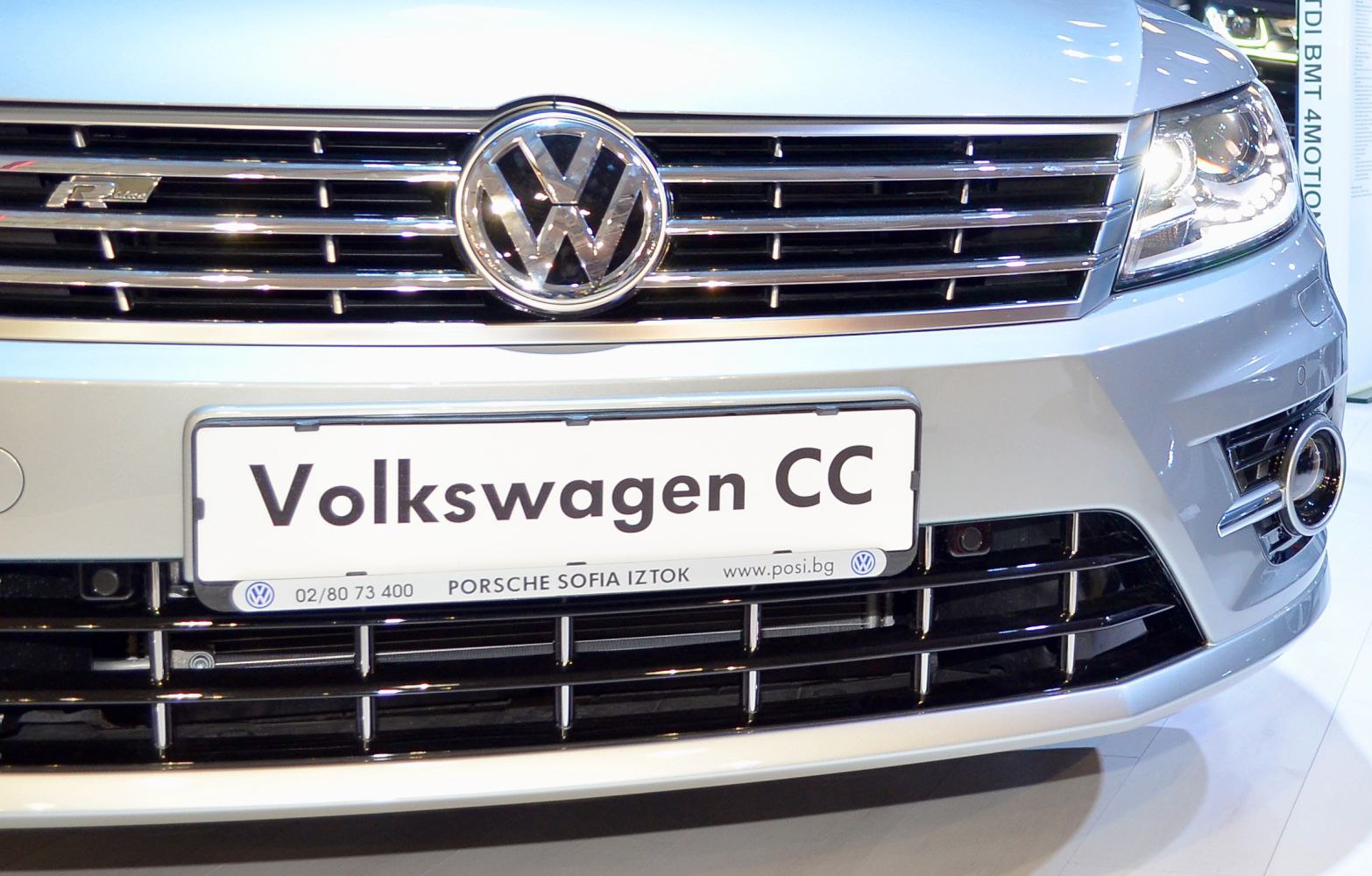 Close-up of front grille and LED headlight with VW emblem