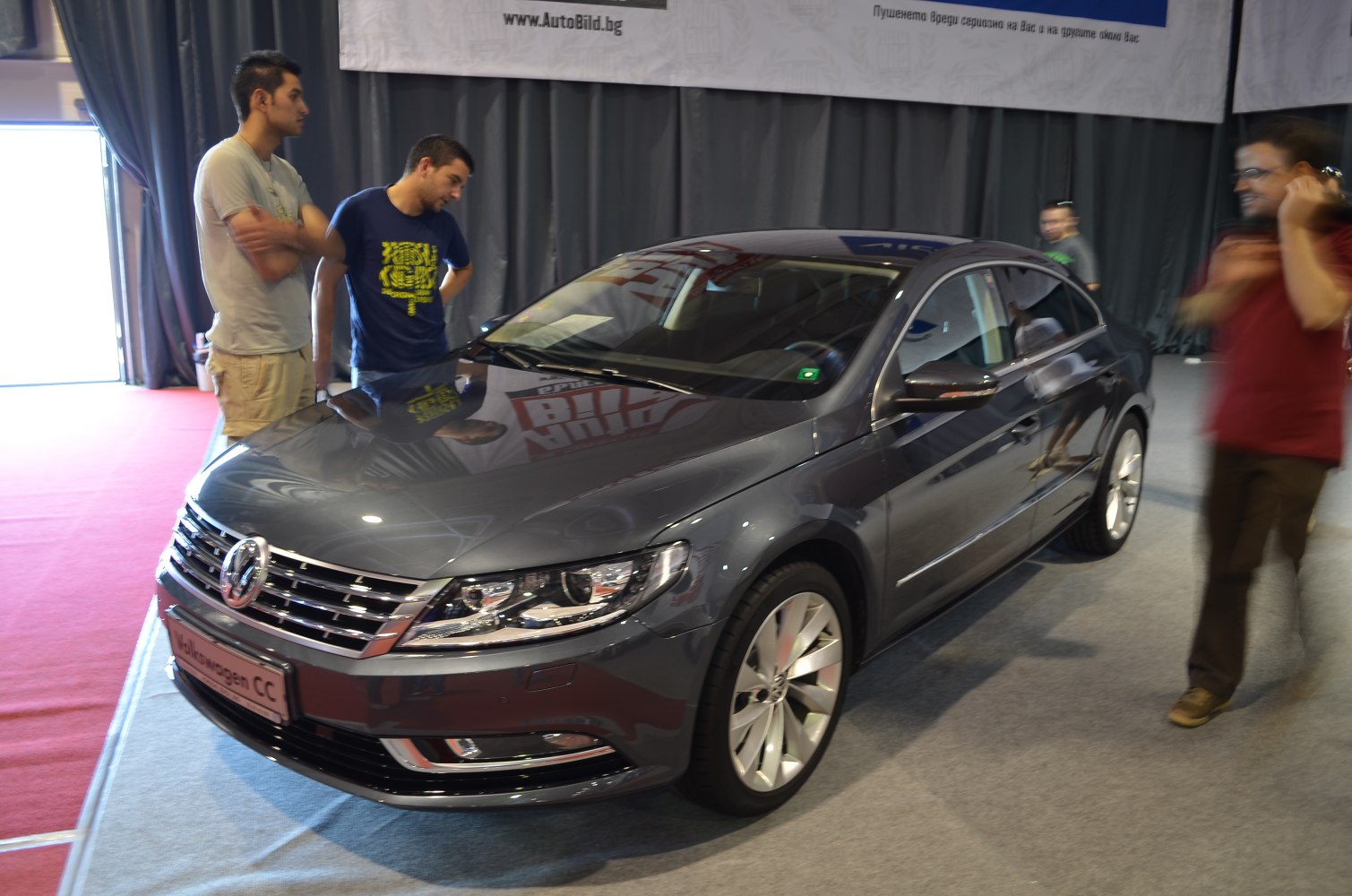 Front view with grille, headlights, and alloy wheels of a sleek sedan