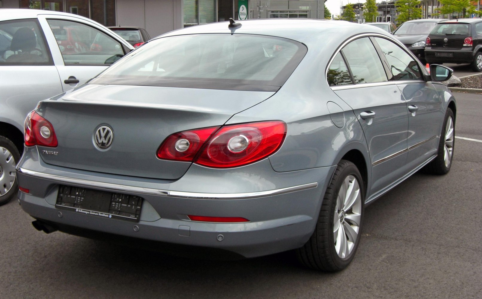 Sleek rear sedan view with red tail lights and alloy wheels