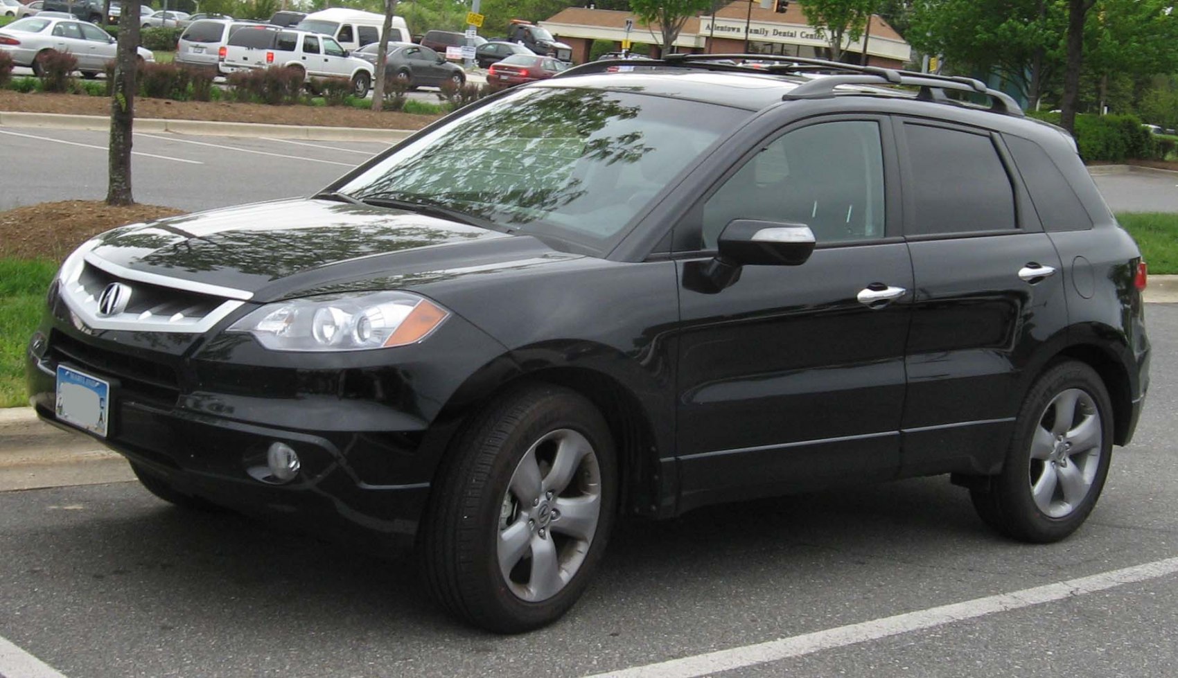 Front side view of SUV with roof rails and alloy wheels