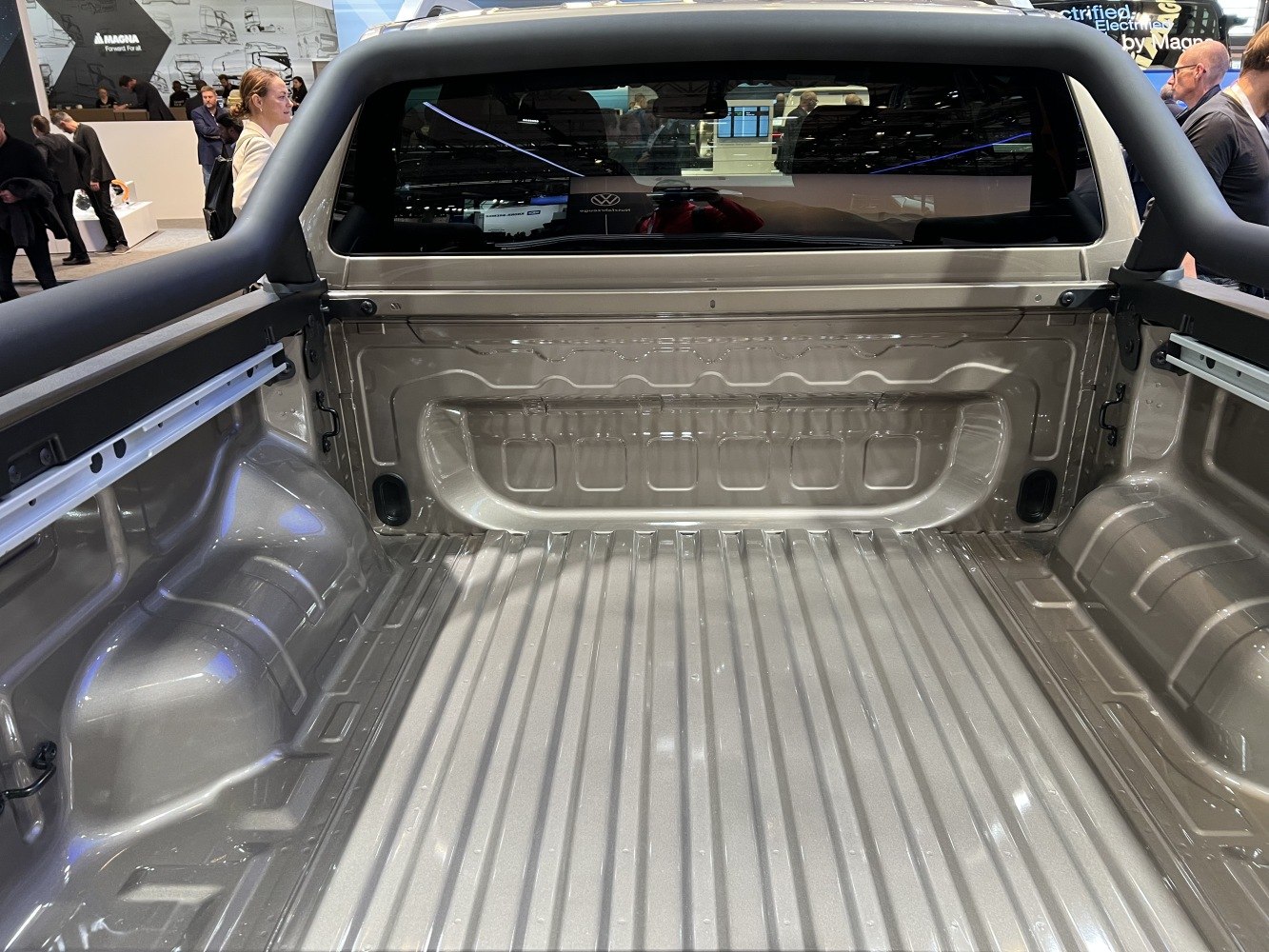 Spacious and sturdy pickup truck bed with ribbed floor and wheel arch contours