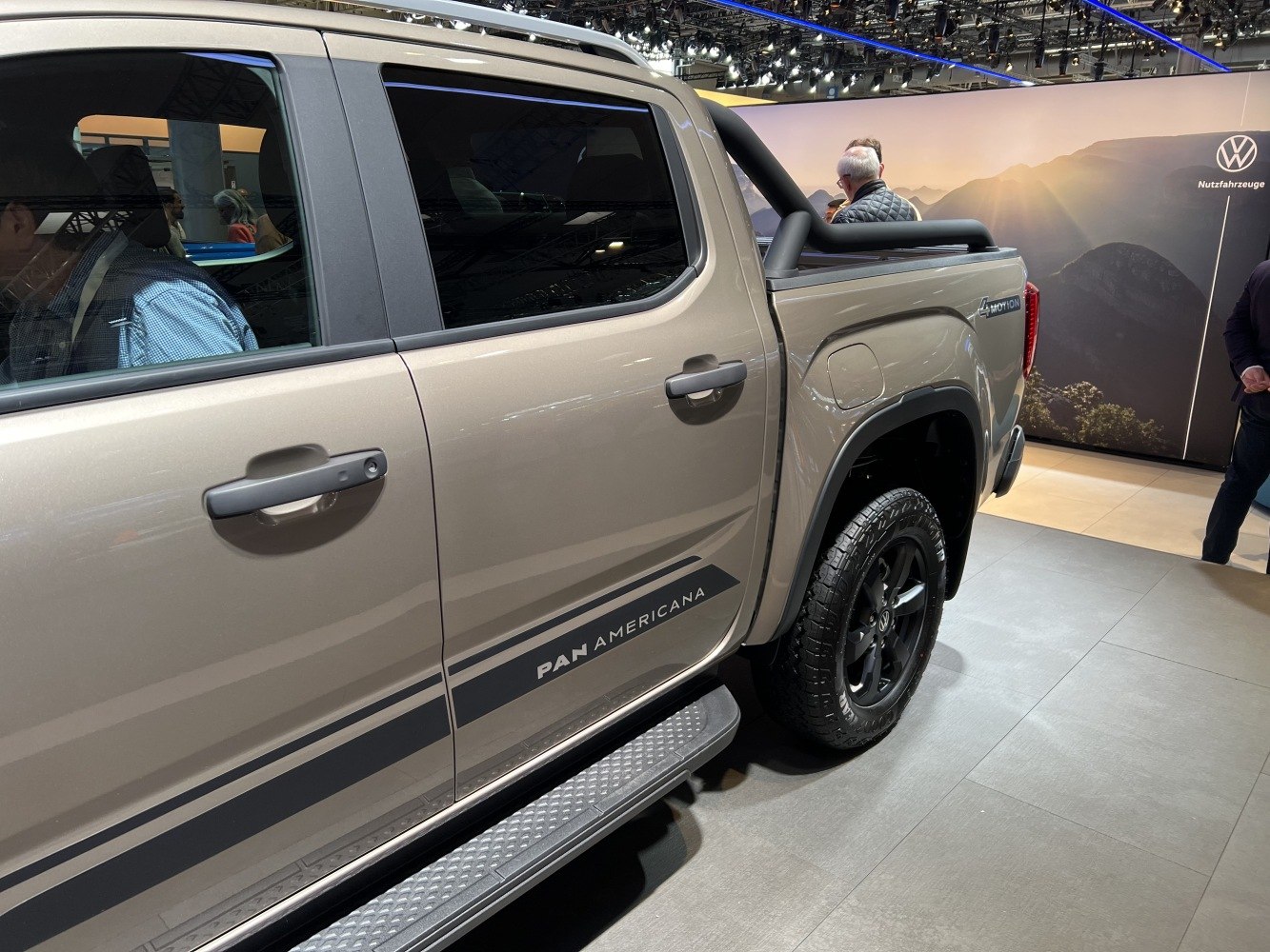 Pickup side showing Pan Americana badge, running board, rear wheel, and 4MOTION emblem