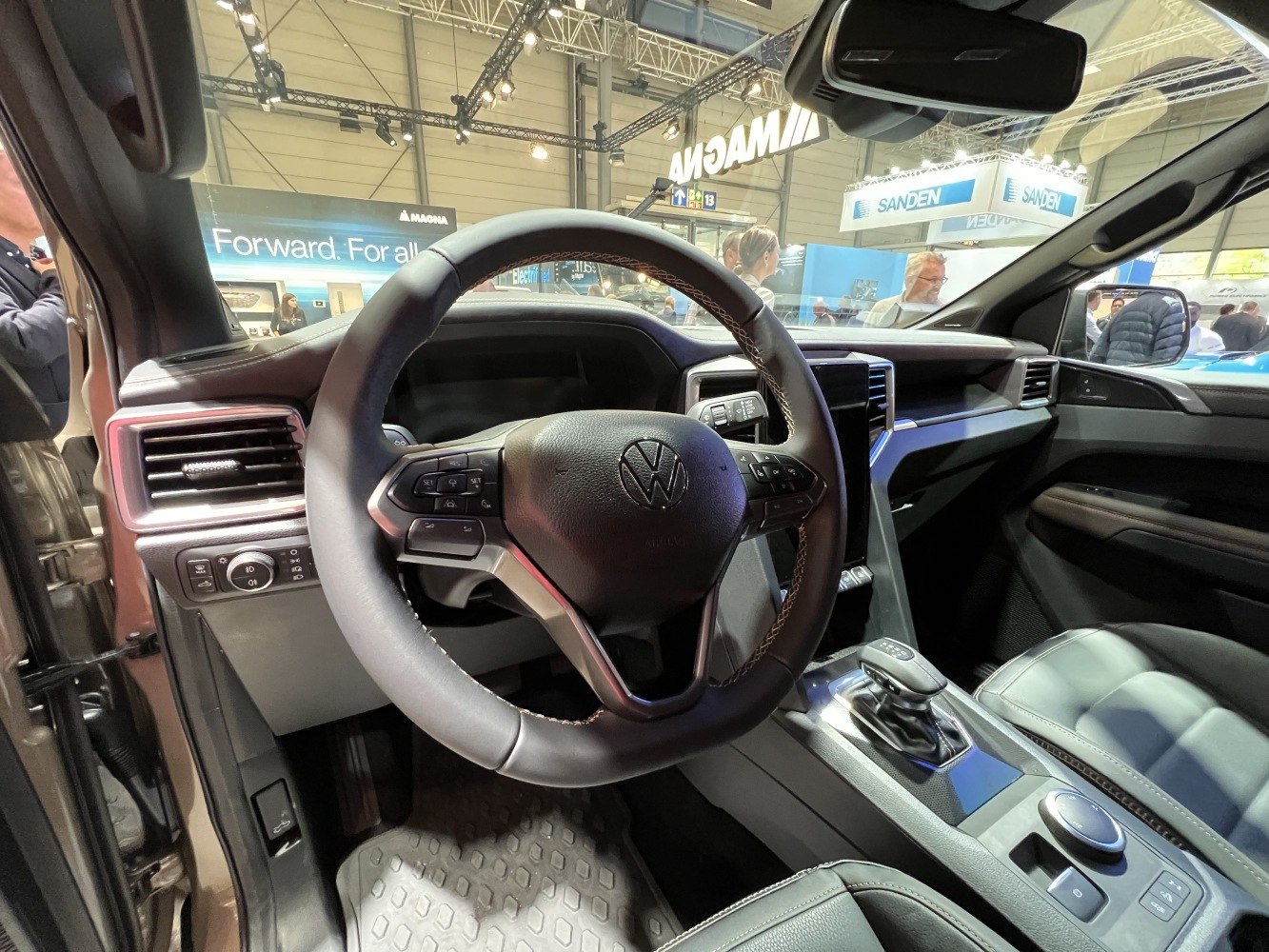 Modern steering wheel and center console with gear shifter and control buttons