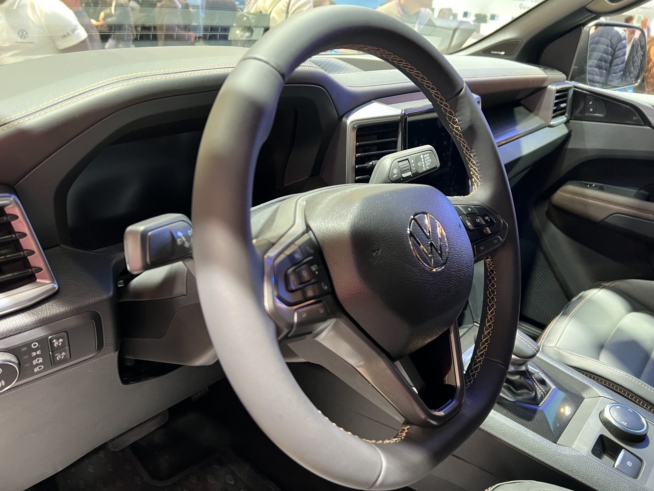 Steering wheel with control buttons and dashboard detail