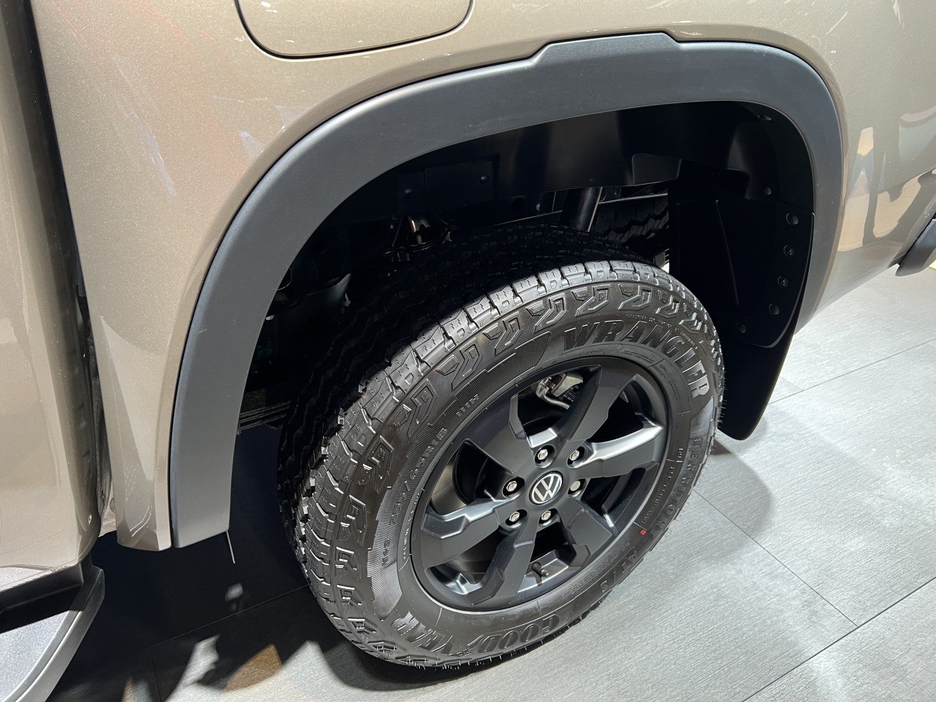 Close-up of alloy wheel and off-road tire on vehicle