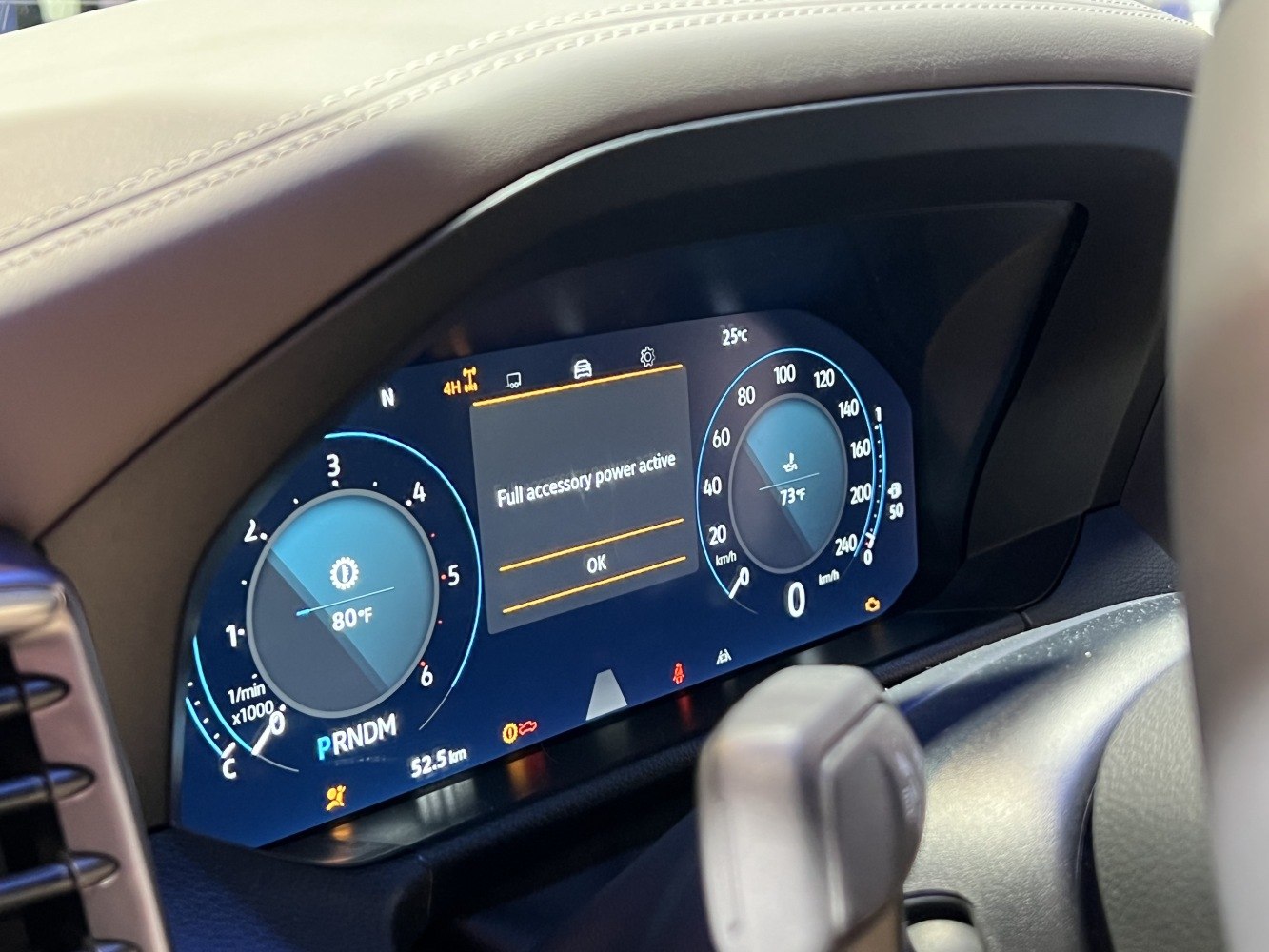 Digital instrument cluster with speedometer, tachometer, and system alerts
