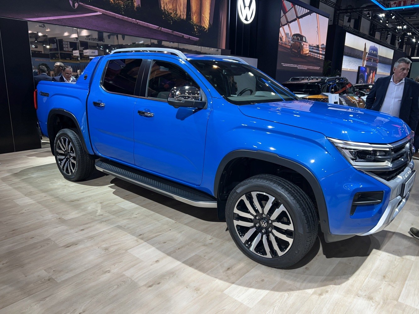 Blue pickup truck with alloy wheels and side steps