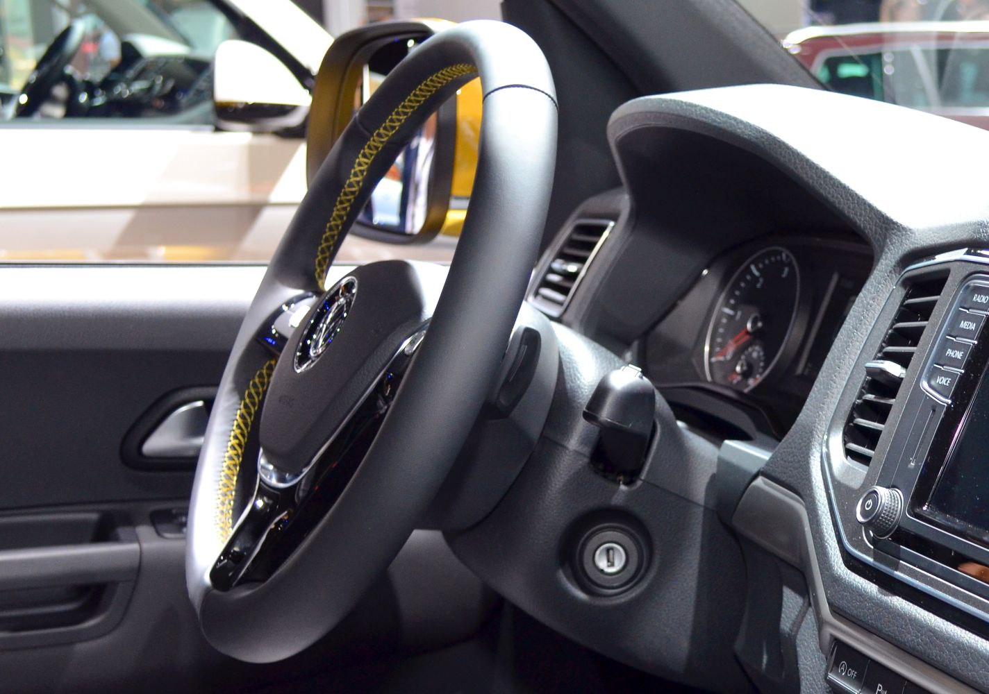 Steering wheel and dashboard controls close-up interior view