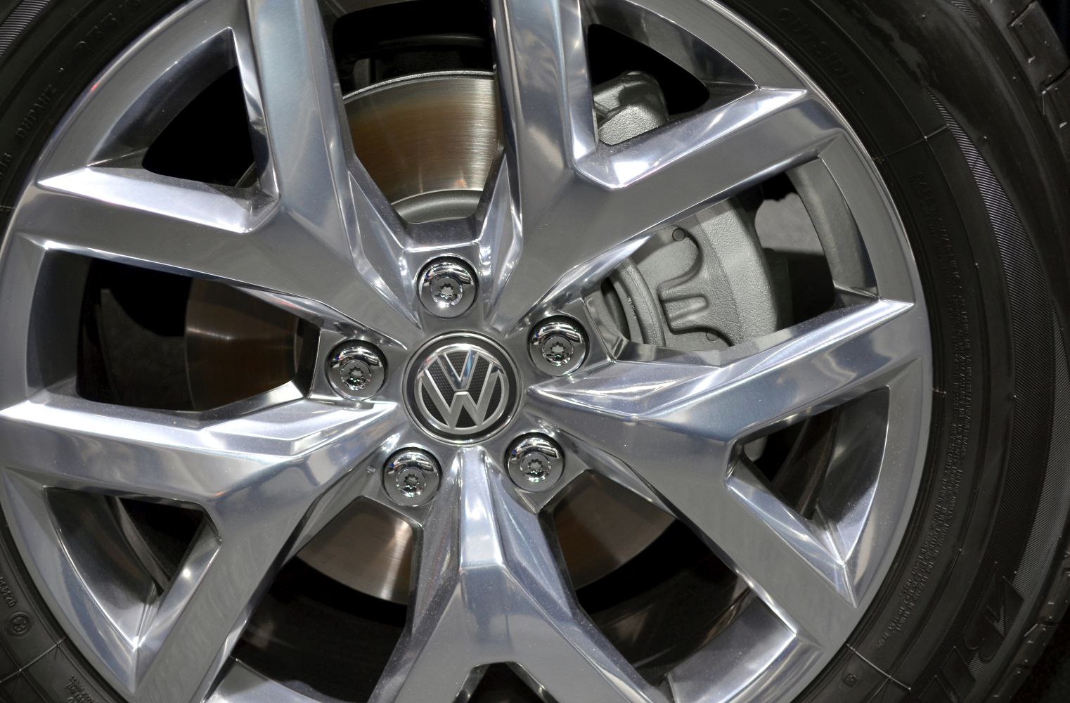 Polished alloy wheel with visible brake disc and caliper